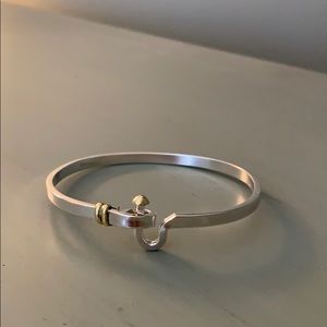 Sterling silver and gold bracelet.